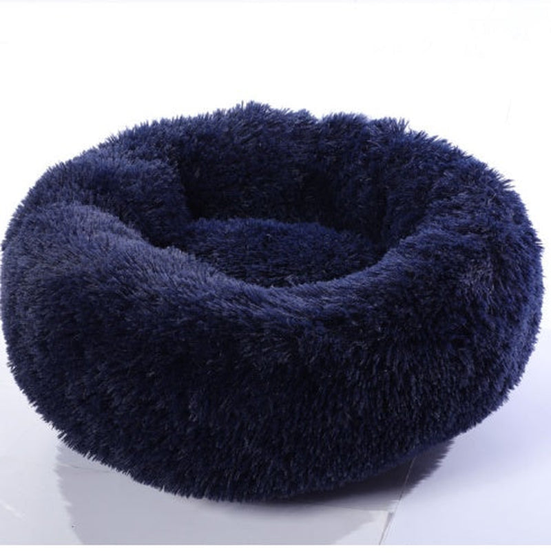 All Dogs Love navy blue plush round calming pet bed with a raised rim for head and neck support
